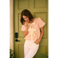 BUBBLE PEPLUM TOP WITH TEXTURED FABRIC AND BOW
